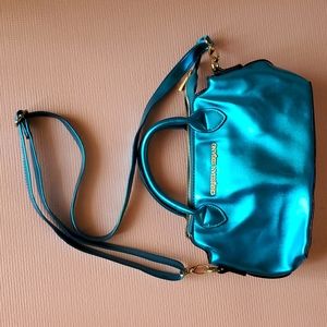 New Christian Siriano Handbag Color is Metallic Turquoise Blue.